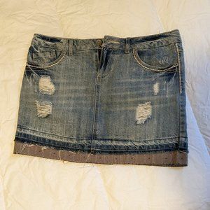 Distressed denim mini skirt